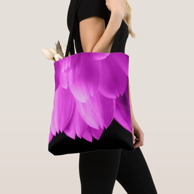 Hot pink flower petals on black tote bag (Close Up)