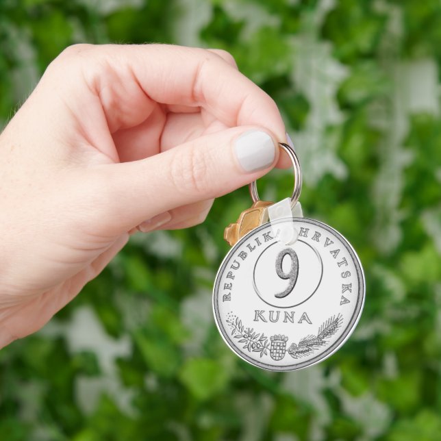 Hotel key with kuna as room number key ring (Hand)