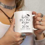 Hotter By One Degree | Graduation Coffee Mug<br><div class="desc">Fun Graduation coffee mug,  perfect gift for your graduate! The mug features different typography text which reads 'HOTTER BY ONE DEGREE' The graduation year,  graduates name and a graduation hat. The text and hat colour can be changed by clicking on the customise further link.</div>