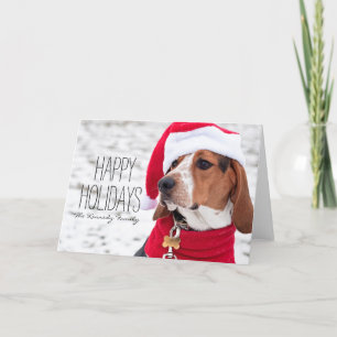 Hound dog wearing a winter coat and a Christmas Holiday Card