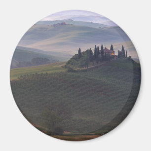 House in Tuscany in the morning fog round magnet