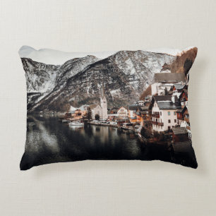 HOUSES NEAR BODY OF WATER AND MOUNTAIN DECORATIVE CUSHION