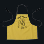 HUFFLEPUFF™ Dedication Patience Loyalty Crest Apron<br><div class="desc">Celebrate loyalty, patience, and unwavering dedication with this bold Hufflepuff™ crest design. Featuring the proud badger set within a classic shield, this striking artwork highlights the house’s defining traits — Dedication, Patience, and Loyalty — in a timeless, vintage-inspired layout. Rendered in signature house colors with detailed linework and subtle magical...</div>