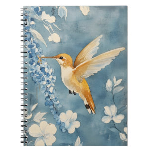 hummingbird in flight amidst white flowers  notebook