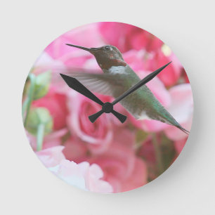 Hummingbird in pink spring flowers round clock