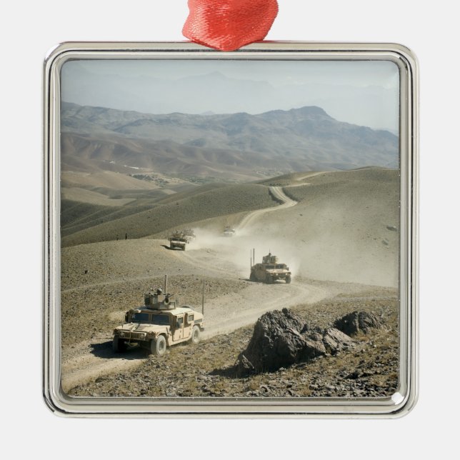 Humvees traverse rugged mountain roads metal tree decoration (Front)