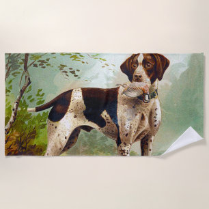 Hunter dog with bird in mouth beach towel