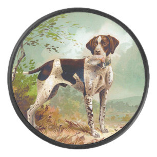 Hunter dog with bird in mouth hockey puck