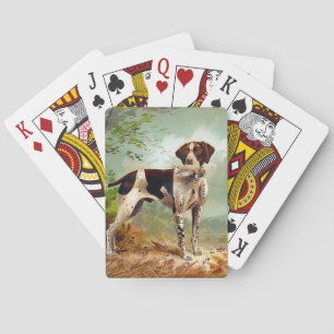 Hunter dog with bird in mouth playing cards