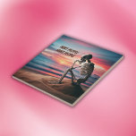 HURT people hurt PEOPLE | Tile<br><div class="desc">A beautiful ocean at sunset with a skeleton sitting in thought on the beach. HURT people hurt PEOPLE.</div>