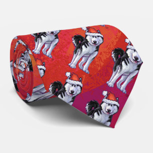 Husky in Santa Hat On Red Tie