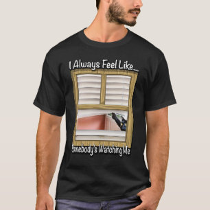 I Always Feel Like Somebody's Watching Me By Yora T-Shirt