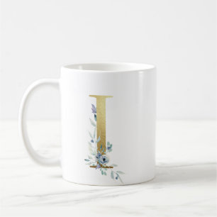 I golden initial with blue floral foliage coffee mug