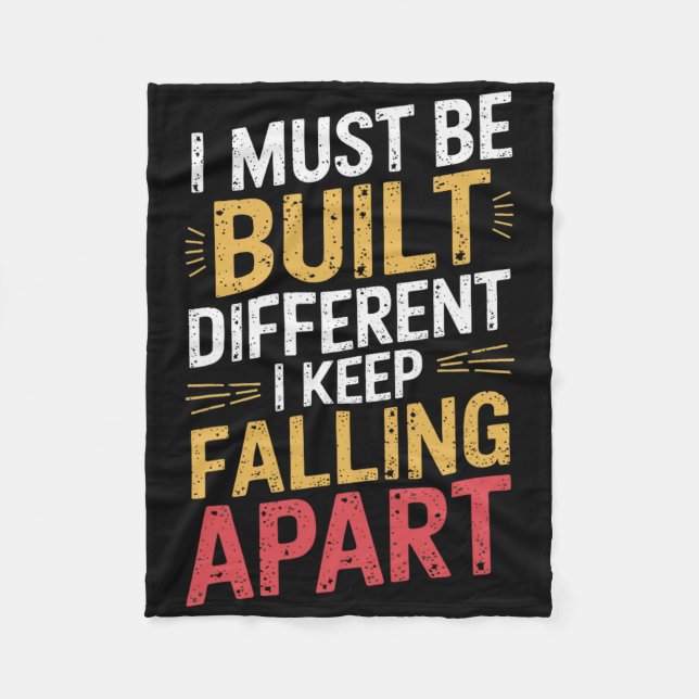 I Must Be Built Different I Keep Falling Apart  Fleece Blanket (Front)