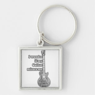 I wonder if my guitar misses me. Black and white Key Ring