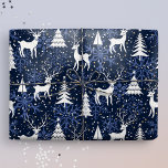 Ice Crystal Christmas Deer Cobalt Blue Wrapping Paper<br><div class="desc">This whimsical gift wrap features a festive Nordic woodland scene with deer, Christmas trees, and snowflakes. With tiny golden stars, it is ready to add a touch of magic and wonder to your winter holiday celebrations with your loved ones. Midnight blue background, white deer and trees, and cobalt blue snowflakes....</div>