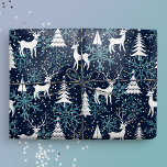 Ice Crystal Christmas Deer Teal Wrapping Paper<br><div class="desc">This whimsical gift wrap features a festive Nordic woodland scene with deer, Christmas trees, and snowflakes. With tiny golden stars, it is ready to add a touch of magic and wonder to your winter holiday celebrations with your loved ones. Midnight blue background, white deer and trees, and teal snowflakes. Original...</div>