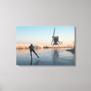 Ice skating past windmill and reeds canvas