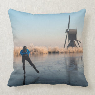 Ice skating past windmill and reeds pillow