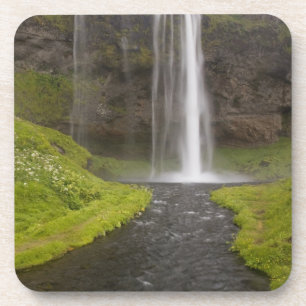 Iceland. People on trail behind Seljalandsfoss Coaster