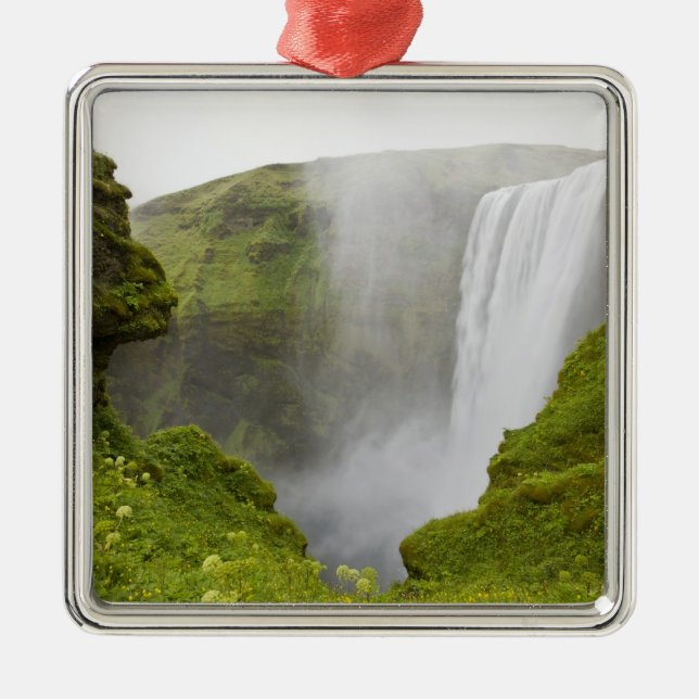 Iceland. Skogarfoss Waterfall plunges over a Metal Tree Decoration (Front)