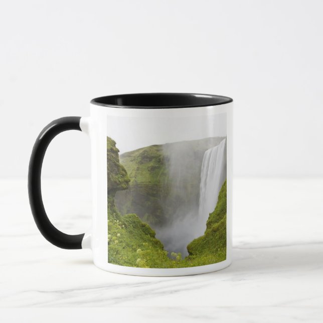 Iceland. Skogarfoss Waterfall plunges over a Mug (Left)