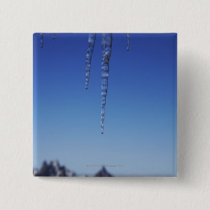 Icicles and snow-covered mountains 15 cm square badge