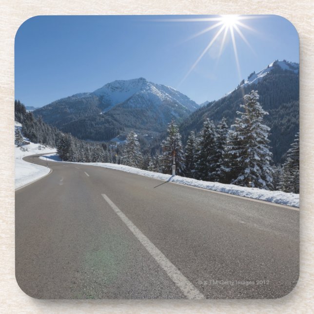 Idyllic empty road thrugh a winter landscape, coaster (Front)