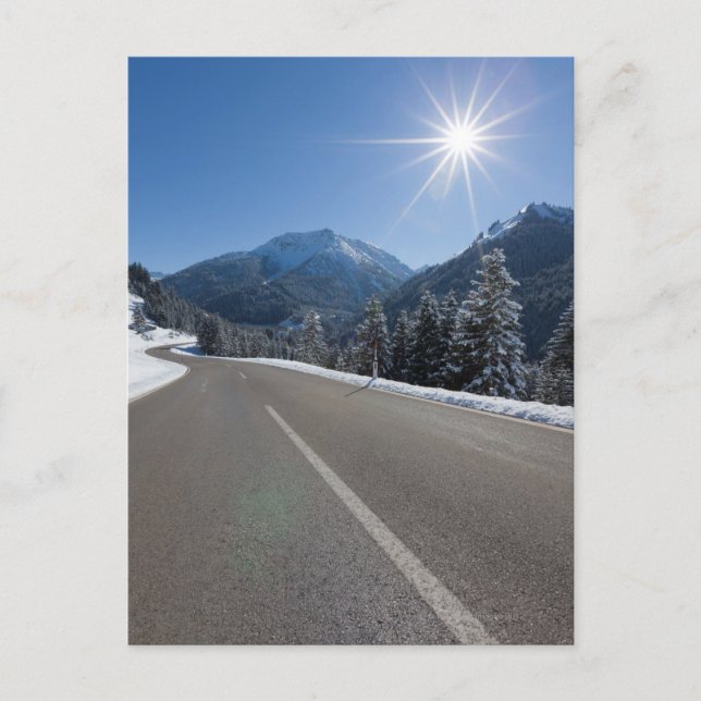Idyllic empty road thrugh a winter landscape, postcard (Front)