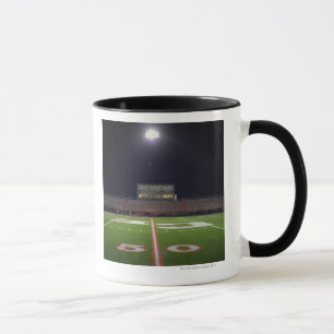 Illuminated American football field at night Mug