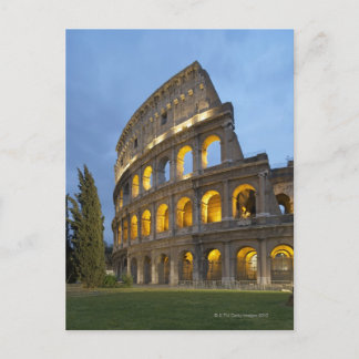 Illuminated section of the Colosseum at dusk. Postcard