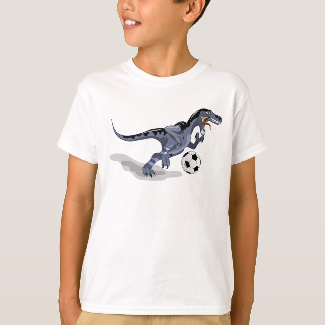 Illustration Of A Raptor Dinosaur Playing Soccer. T-Shirt (Front)