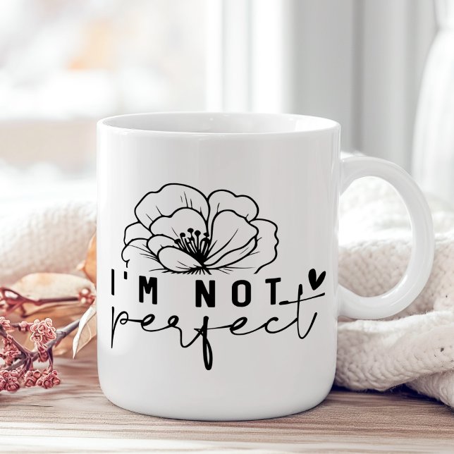 "I'm Not Perfect" Black and White Floral  Coffee Mug ("I'm Not Perfect" Black and White Floral Coffee Mug on a sunny boho wooden table with pink flower.)