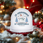 I'm Surrounded By Snowflakes Funny Custom Snowglobe<br><div class="desc">This quirky snow globe delivers festive flair and a little bit of attitude! Featuring a cheerful snowman flanked by pastel Christmas trees and the playful phrase “I’m Surrounded By Snowflakes, ” it’s the perfect holiday decoration for anyone with a sense of humour. Add your family name or custom message for...</div>