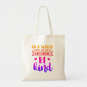 in a world where you can be anything be kind tote bag