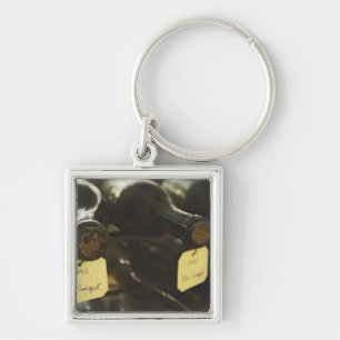 In the underground wine cellar: lying bottles in key ring