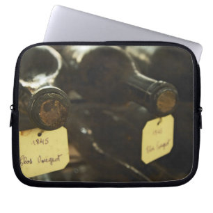 In the underground wine cellar: lying bottles in laptop sleeve