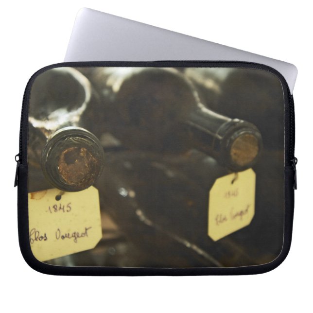 In the underground wine cellar: lying bottles in laptop sleeve (Front)