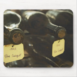 In the underground wine cellar: lying bottles in mouse pad
