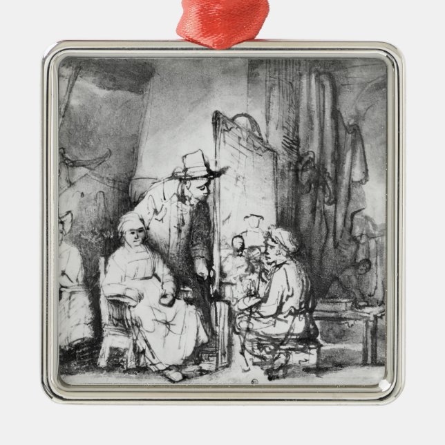 Interior of studio with painter painting metal tree decoration (Front)