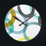 Interlocking Yellow & Blue Circles Round Clock<br><div class="desc">A simple print of interlocking yellow and blue circles by Megan Meagher. The white background lets the colours of the circles pop. Purchase yours today!</div>