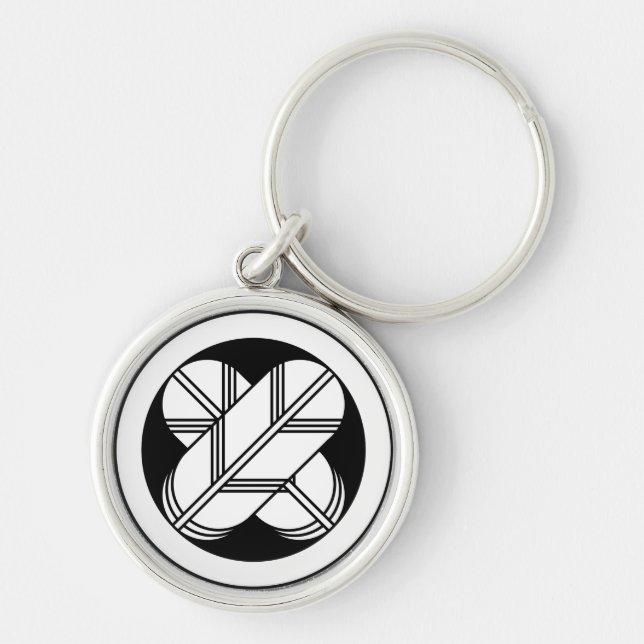 Intersecting hawk feathers in a circle keychain (Front)