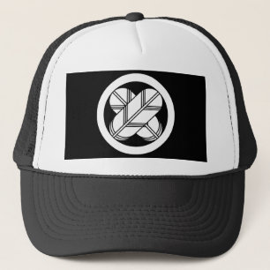 Intersecting hawk feathers in circle trucker hat