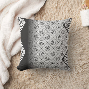 Intricate black and white pattern featuring floral cushion