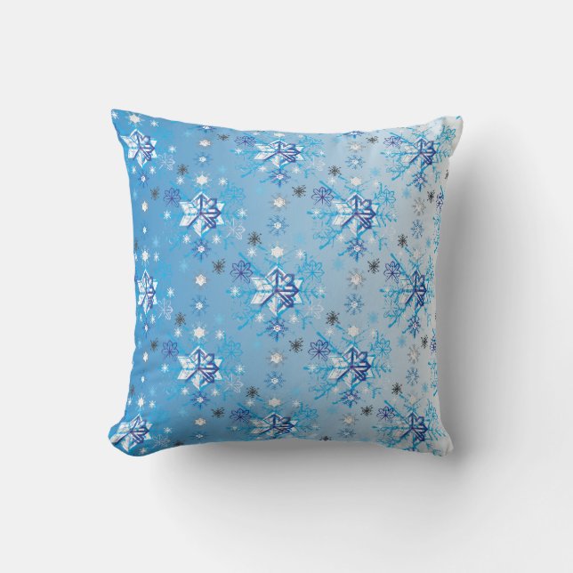 Intricate blue and white stars and snowflakes cushion (Front)
