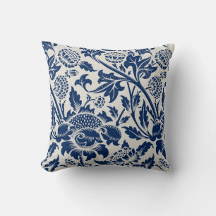 Intricate blue floral pattern on light background cushion