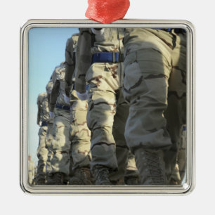 Iraqi air force recruits march metal tree decoration