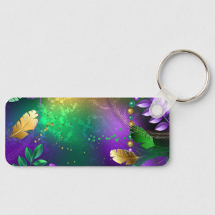 Iridescent mardi gras background with beads key ring