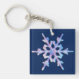 Iridescent snowflake on dark blue key ring