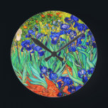 Irises by Vincent Van Gogh Round Clock<br><div class="desc">Vincent Van Gogh Irises . Painted in 1889 it is one of the painting he created in Saint Paul-de-Mausole asylum in Saint-Rémy-de-Provence in France. It is an oil painting. This fine art landscape oil painting depicts a field of iris flower plants. Vincent Van Gogh was a famous artist. He was...</div>